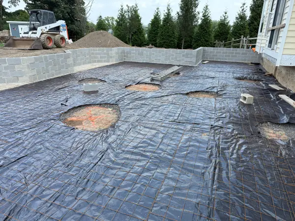 Excavation and base preparation before a concrete pour